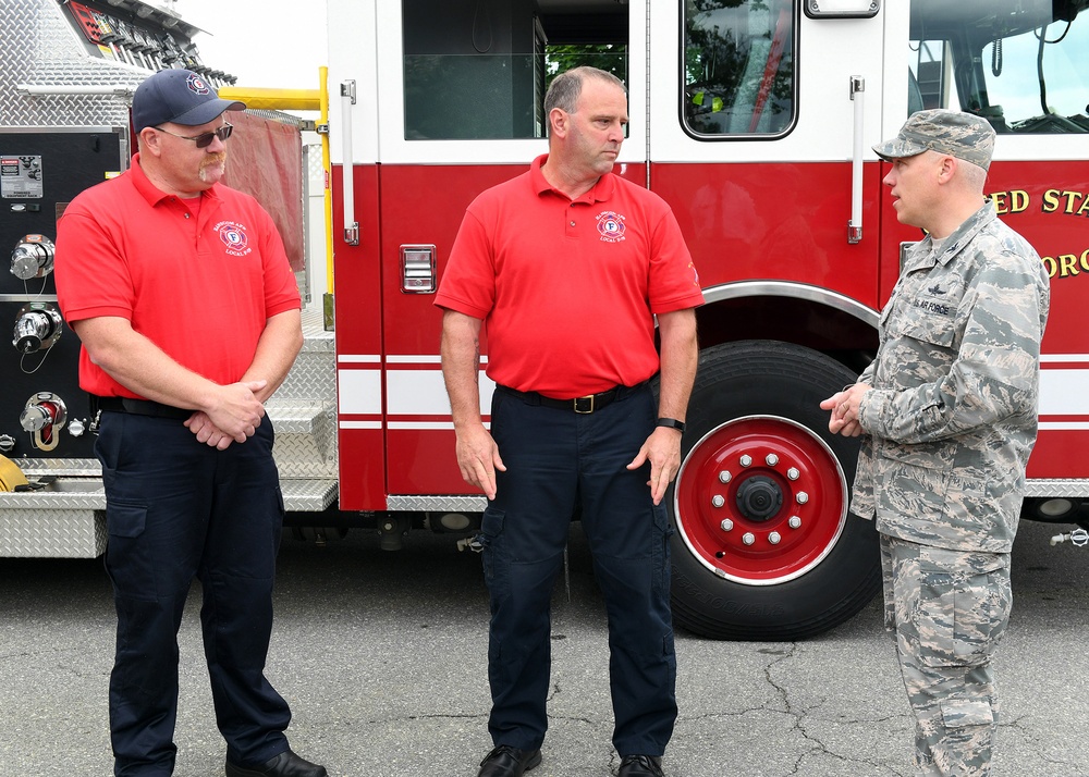 Hund recognizes Hanscom fire fighters