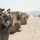 Soldiers with the 56th Stryker Brigade Combat Team roll out to the box