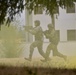 Officer candidates run through smoke