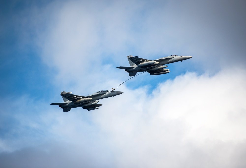 EA-8G Growler and F/A-18E Super Hornet conduct in-flight Refueling