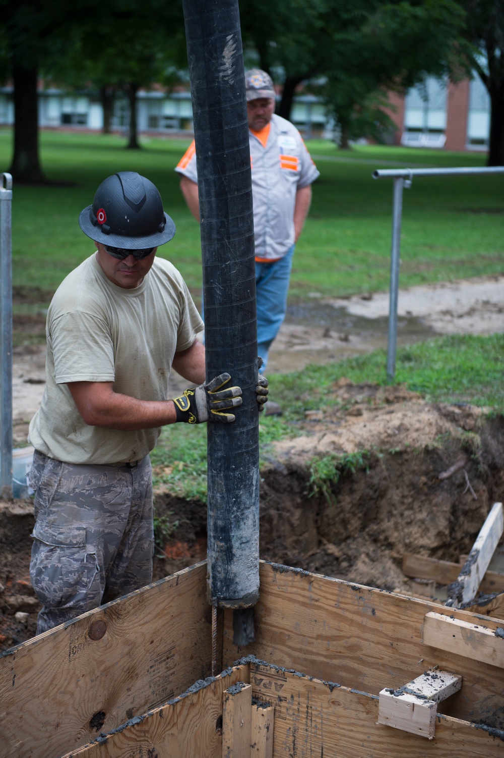 Staff Sgt. Jack Simonds assists with a concrete stem wall