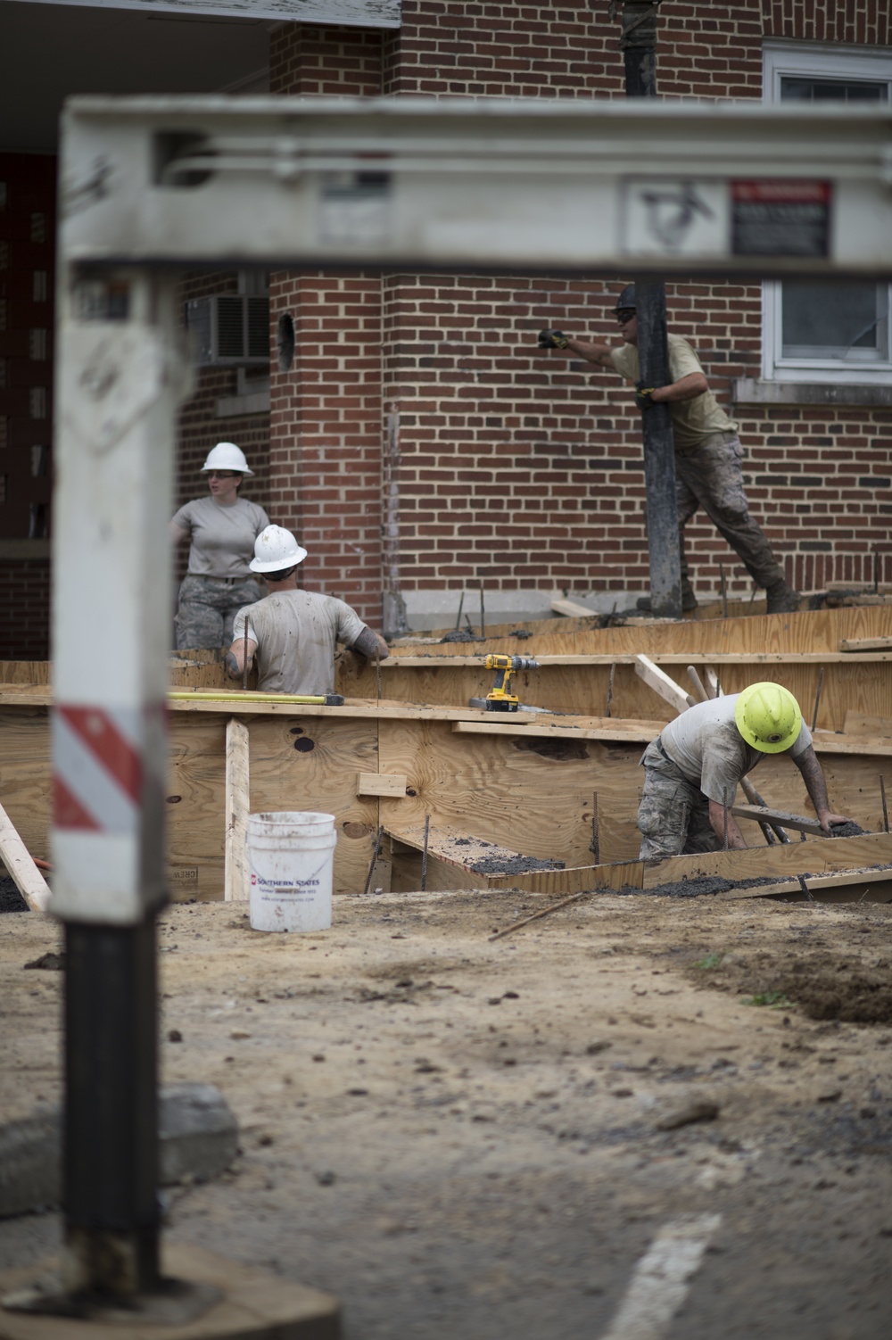 Airmen from the 124th Civil Engineer Squadron work on wheelchair ramp