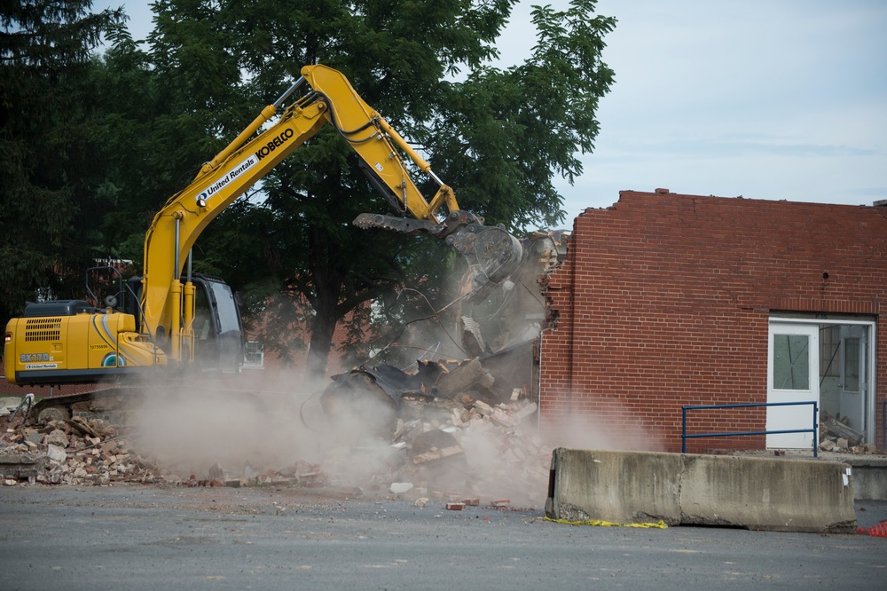 Condemned building is torn down by Airman