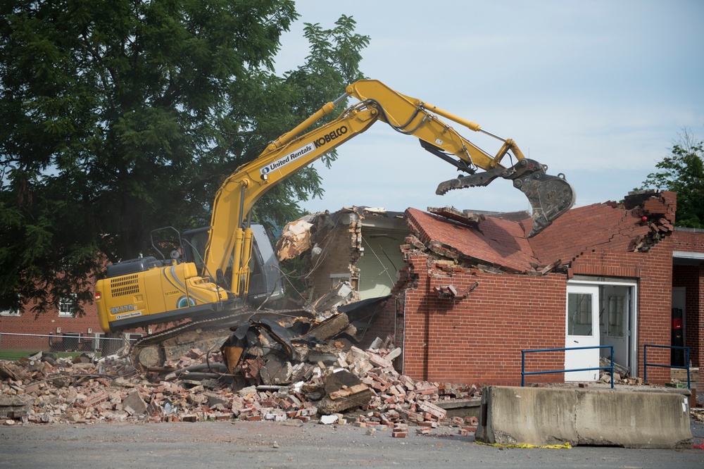 Condemned building is torn down by Airman