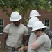 Airmen go over plans to build a parking lot during Innovative Readiness Training