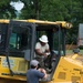 Airman signs for a delivery for a parking lot being built