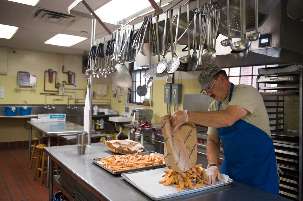 Services Airman prepares lunch during Innovative Readiness Training