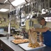 Services Airman prepares lunch during Innovative Readiness Training