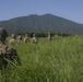 Marines with Company F fire and maneuver in Japan's hills