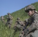 Marines with Company F fire and maneuver in Japan's hills