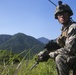 Marines with Company F fire and maneuver in Japan's hills