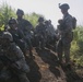 Marines with Company F fire and maneuver in Japan's hills