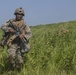 Marines with Company F fire and maneuver in Japan's hills