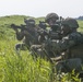 Marines with Company F fire and maneuver in Japan's hills