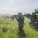 Marines with Company F fire and maneuver in Japan's hills