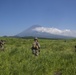 Marines with Company F fire and maneuver in Japan's hills