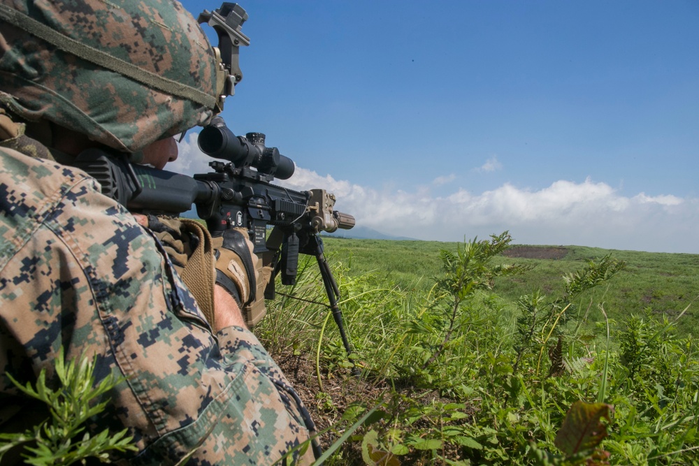 Marines with Company F fire and maneuver in Japan's hills