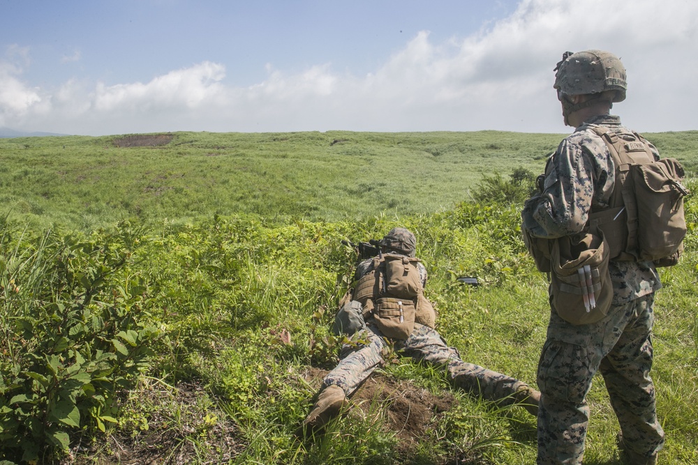 Marines with Company F fire and maneuver in Japan's hills