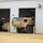 The image shows a military maintenance or storage facility with white metal panel construction and multiple large bay doors. A tan/desert-colored military tactical truck (likely an FMTV or similar heavy military vehicle) is partially exiting or parked in the center bay, while a tracked armored vehicle (likely an M113 or similar APC) is visible inside the left bay. The facility appears to be an active military motor pool or equipment storage building.