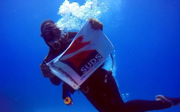 Joint Task Force Troopers assist wounded warriors with scuba dive