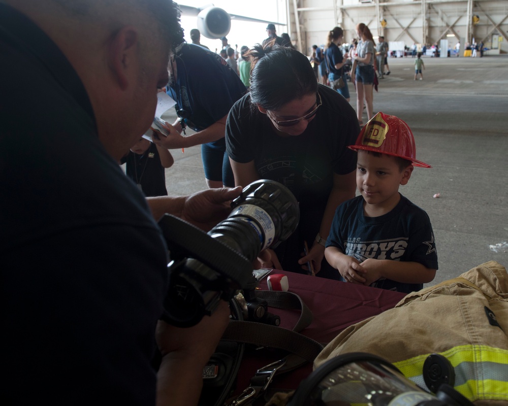 Kids receive free school supplies at deployment line