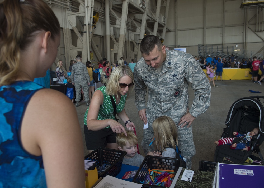 Kids receive free school supplies at deployment line