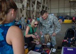 Kids receive free school supplies at deployment line