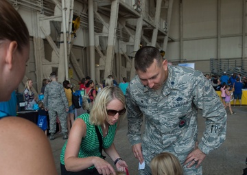 Kids receive free school supplies at deployment line
