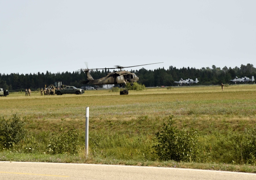 UH-60 Black Hawk helicopters practice sling-loading at Northern Strike 18