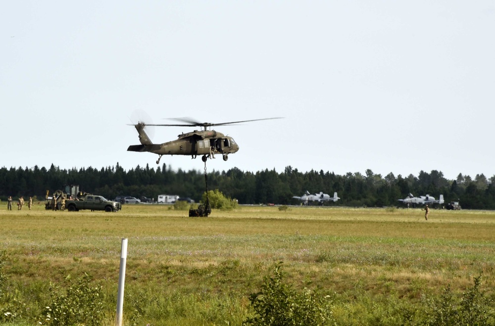 UH-60 Black Hawk helicopters practice sling-loading at Northern Strike 18