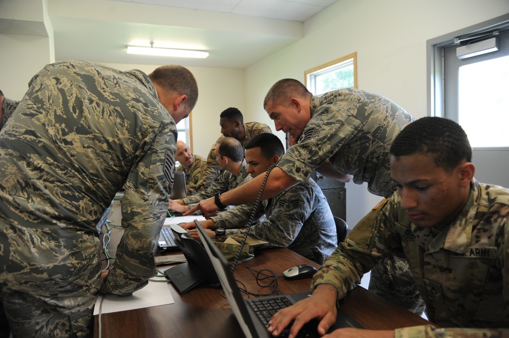 Cyber Mission Defense Teams from Air Force and Army operate together during Exercise Patriot Warrior