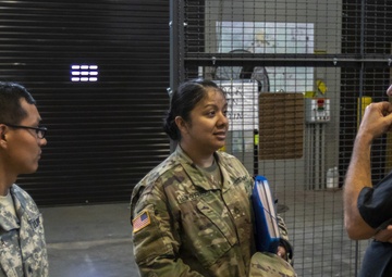 U.S. Army Reserve Soldiers check out MILES gear.