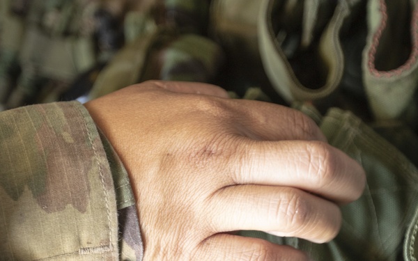 U.S. Army Reserve Soldiers check out MILES gear.
