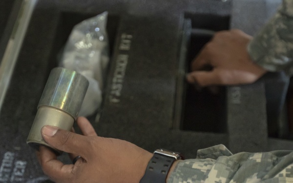 U.S. Army Reserve Soldiers check out MILES gear.