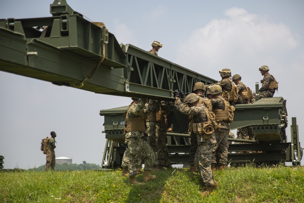 'Brace for weight' | Marines and Sailors construct medium girder bridge