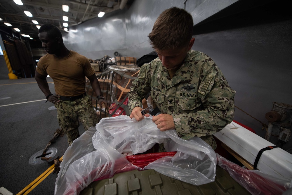 U.S. Navy Sailor checks medical supply inventory
