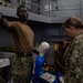 U.S. Navy Sailors inventory medical supplies