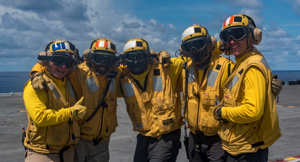 Sailors Pose For A Photo On Flight Deck
