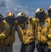 Sailors Pose For A Photo On Flight Deck