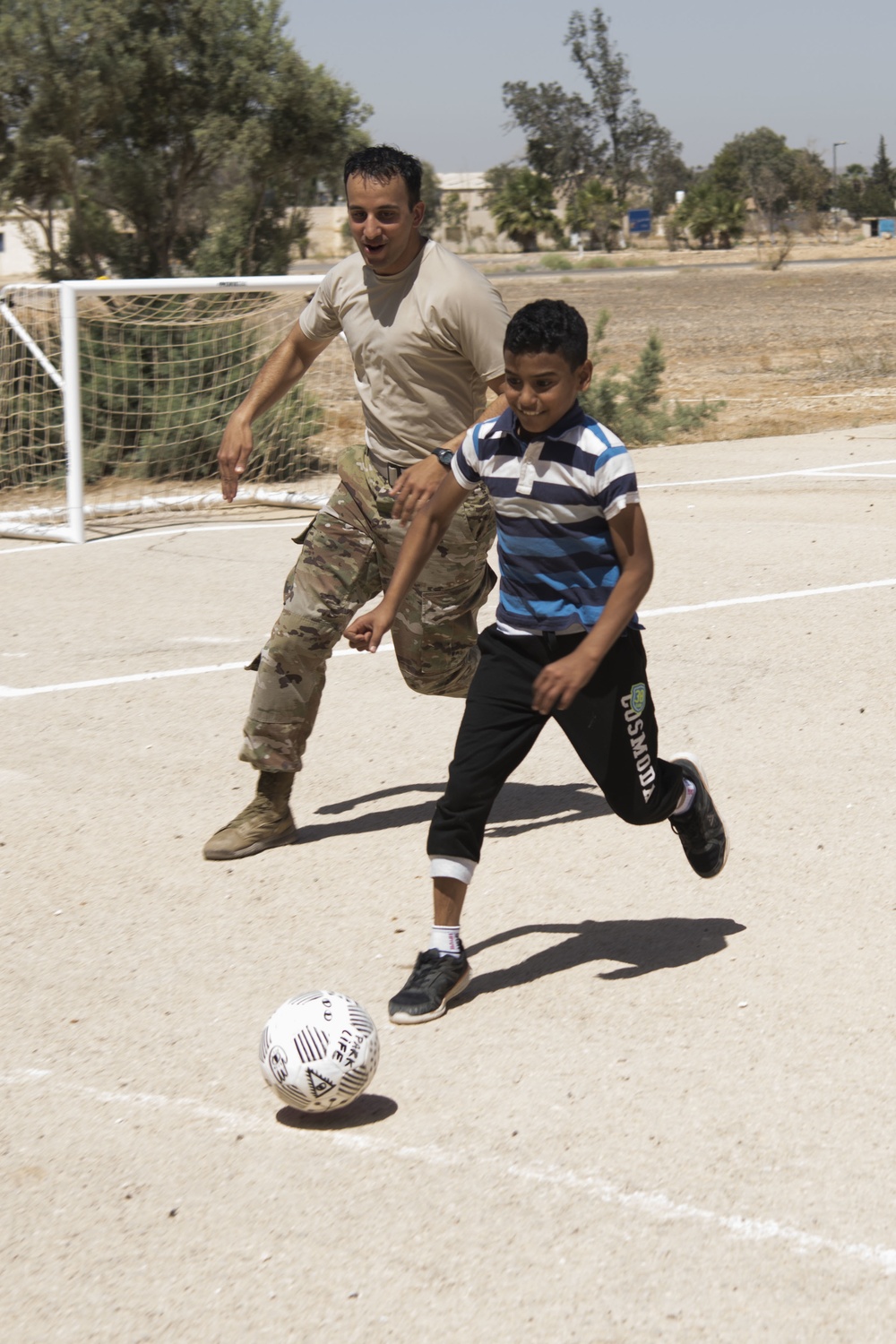 Airman collects donations, renovates soccer field for local kids