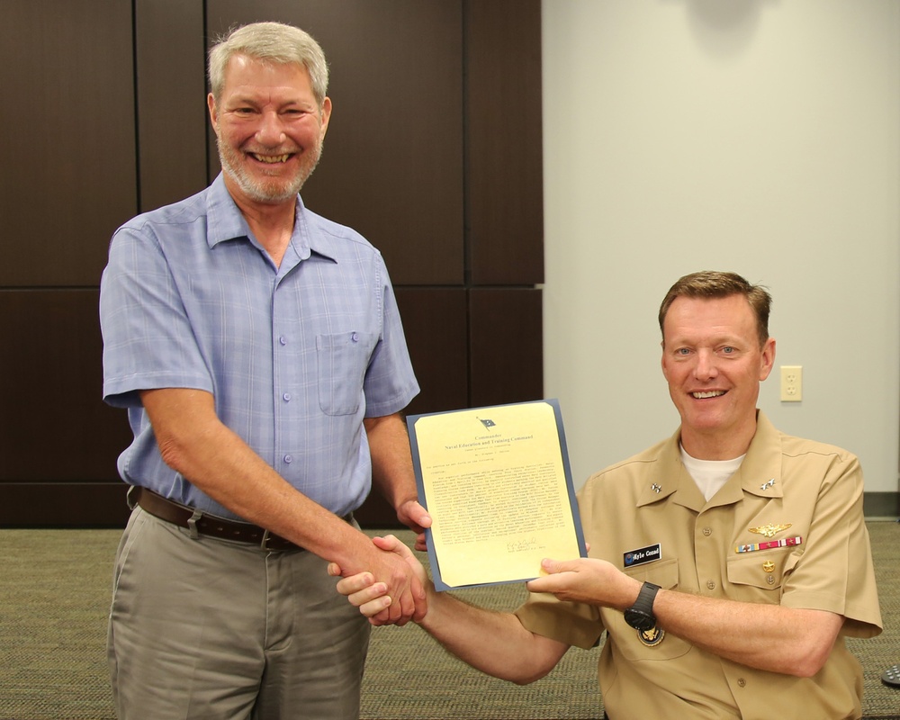 NETC Junior Civilian of the Quarter is Recognized by Rear Adm. Kyle Cozad
