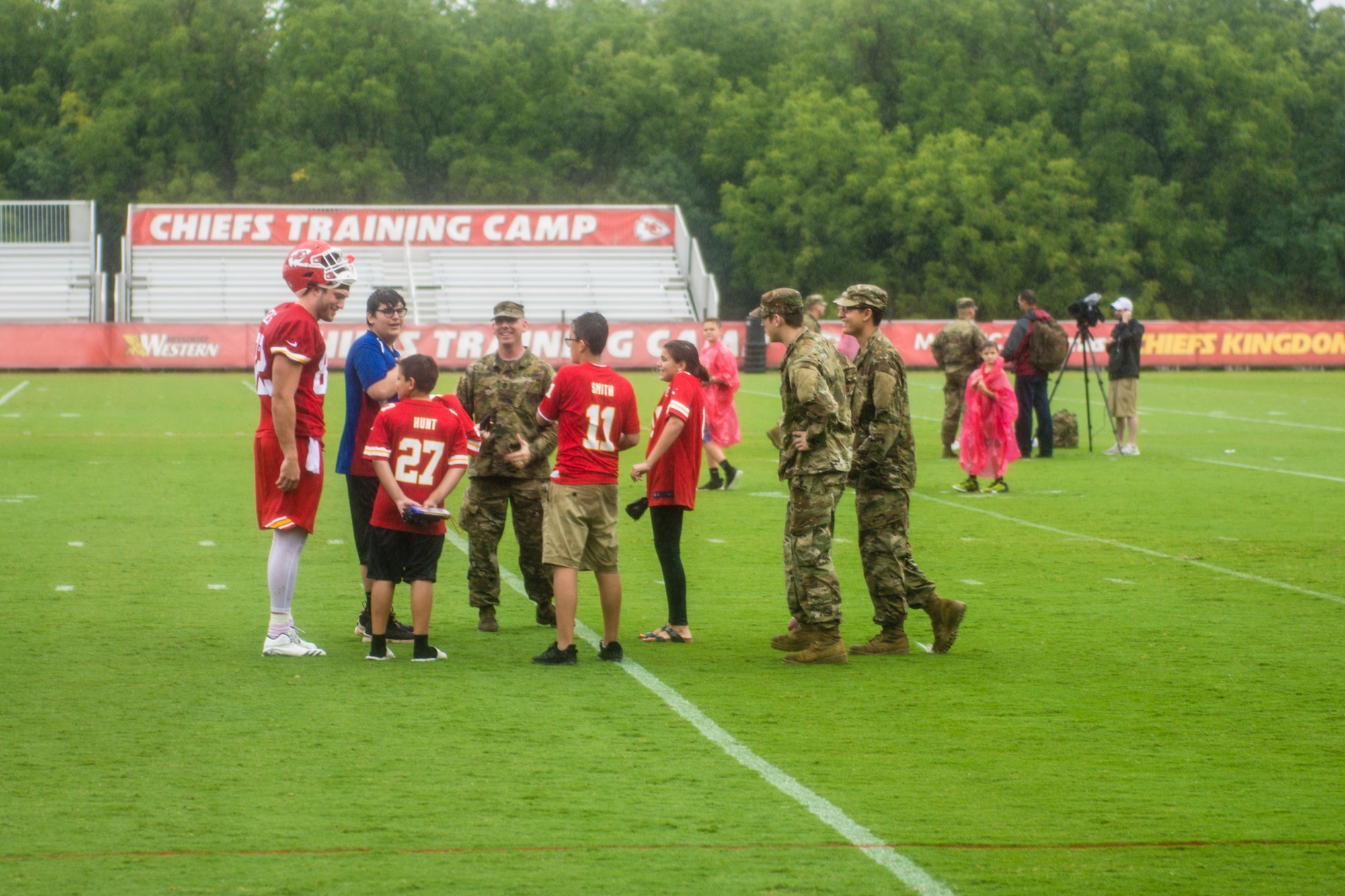 Service members meet with members of the Kansas City Chiefs football team  at the Chief's training camp in St. Joseph, Mo., Aug. 14, 2018. The Chiefs  hosted a military appreciation day on