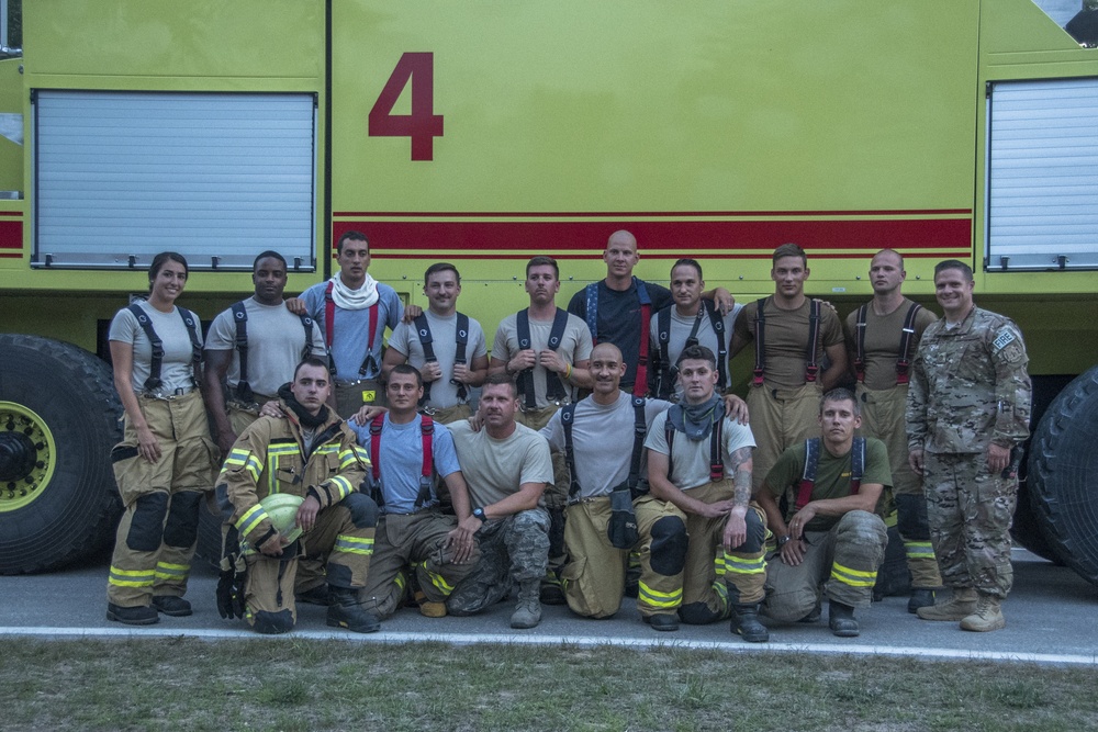 Multinational firefighters perform night burn ops at Northern Strike 18