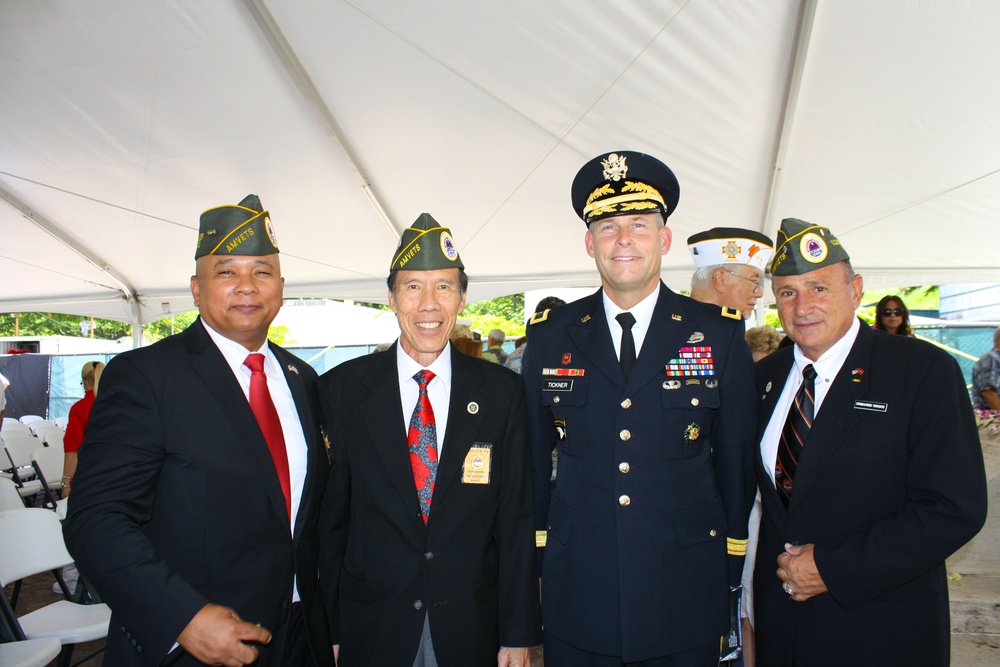 Brig. Gen. Tickner stands with veterans following memorial stone dedication