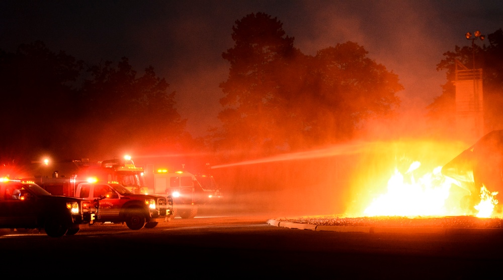 Coalition firefighters perform night burn ops during Northern Strike 18