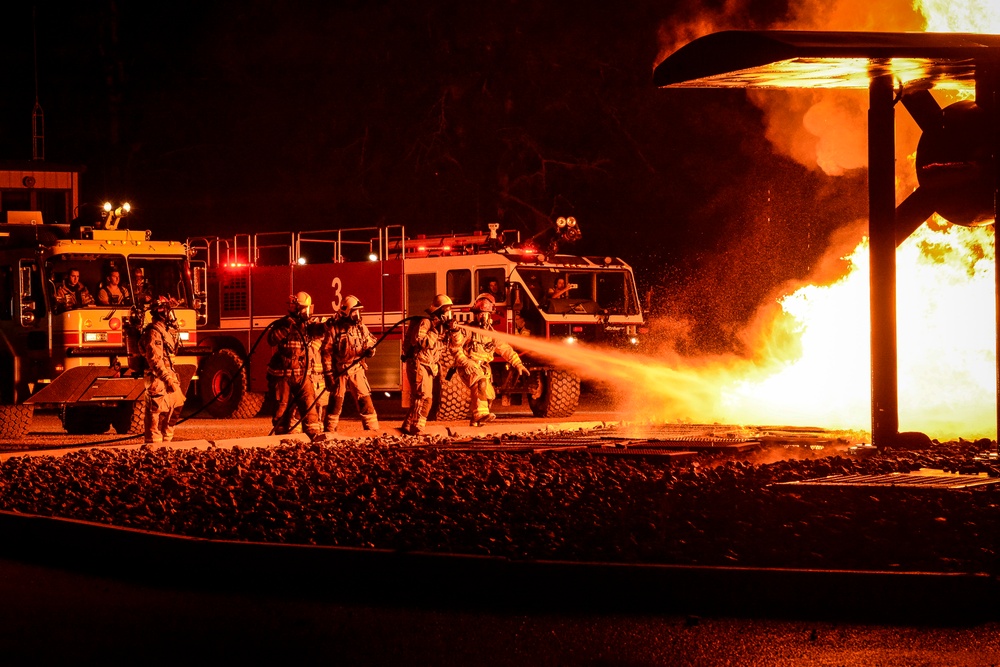 Coalition firefighters perform night burn ops at Northern Strike 18