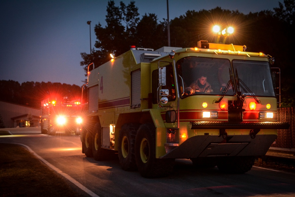 Coalition firefighters perform night burn ops during Northern Strike 18