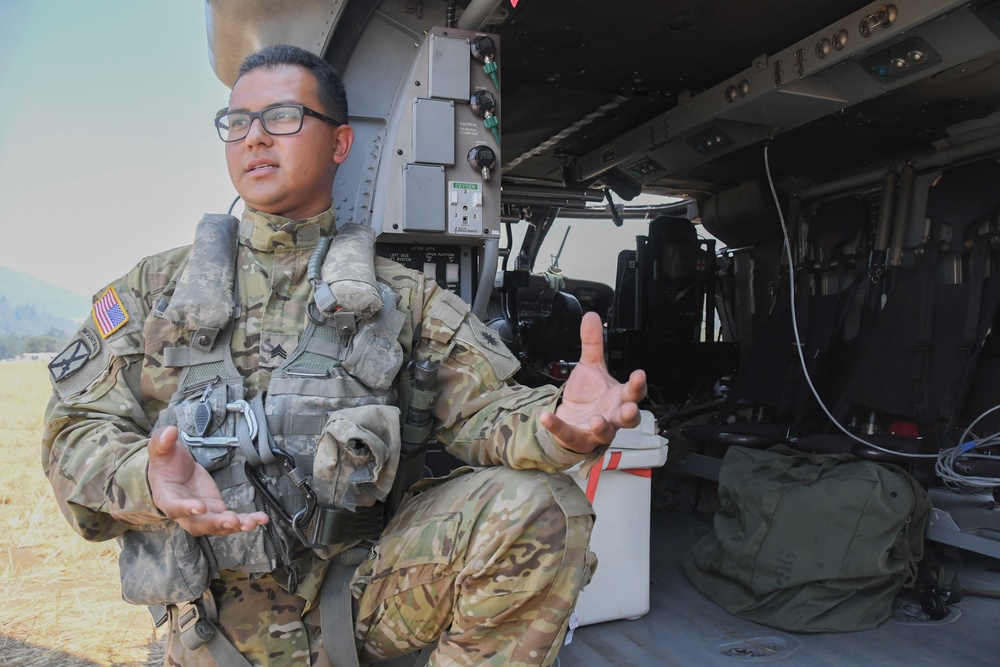 Crew chief Sgt. Bryan Salazar speaks about the HH-60M Medevac Black Hawk [Image 1 of 5]