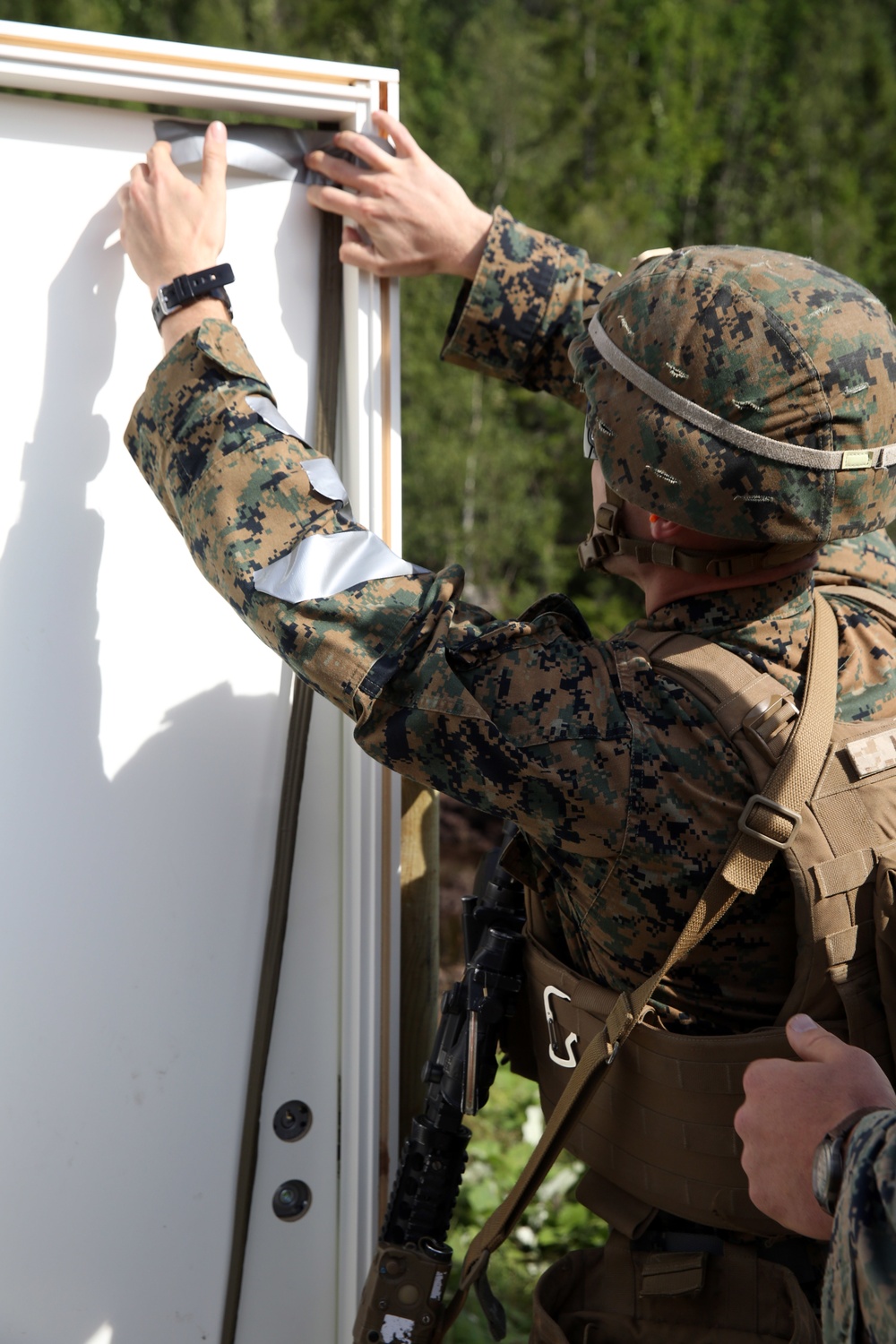 Marines break through barriers during urban breaching range in Norway