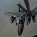 A KC-135 Stratotanker refuels F-15